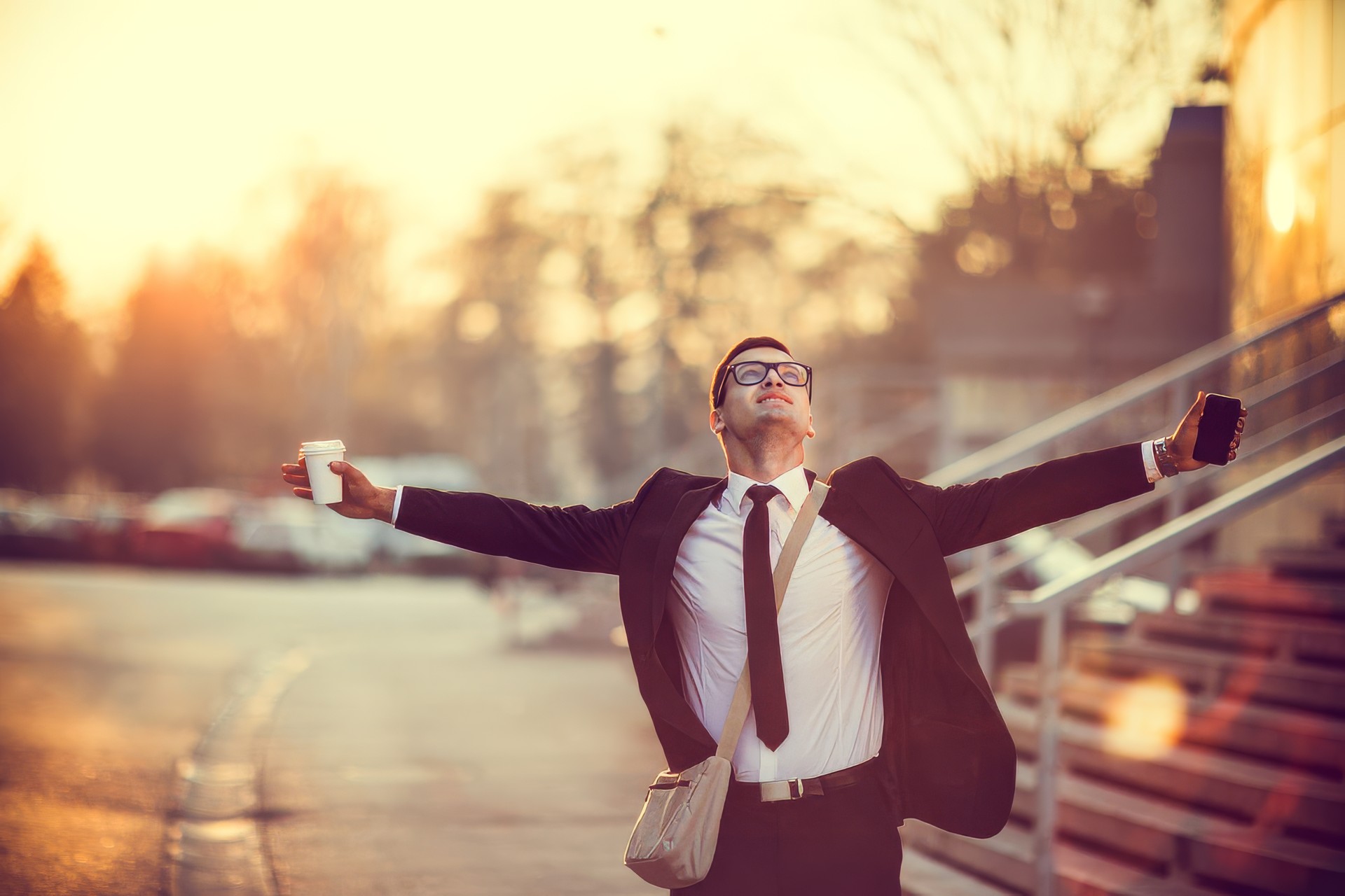 Businessman smiling with arms outstretched